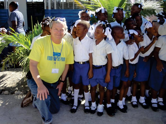 Les with kids in Haiti